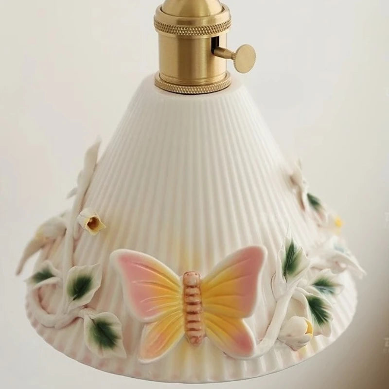 Decorative lamp with butterfly design on a white background