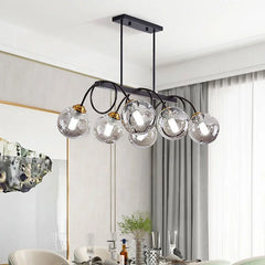 “Modern dimmable globe chandelier with black frame and gold accents.”