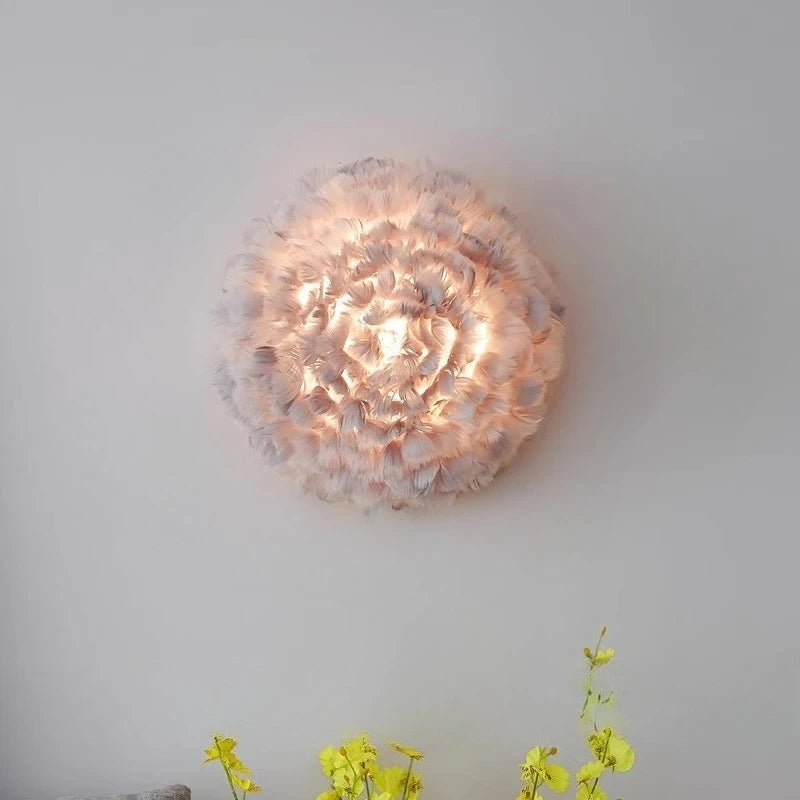 Decorative ceiling light fixture with a floral design on a plain wall.