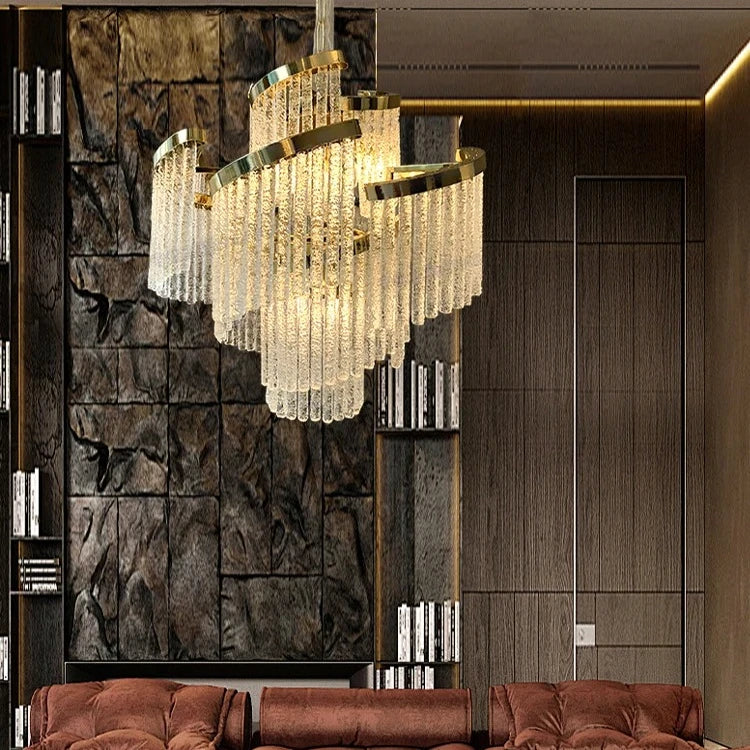 “Modern luxury chandelier with gold and chrome finish and cascading crystal-style design.”