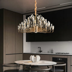Luxury chandelier hanging above a kitchen table with modern decor.