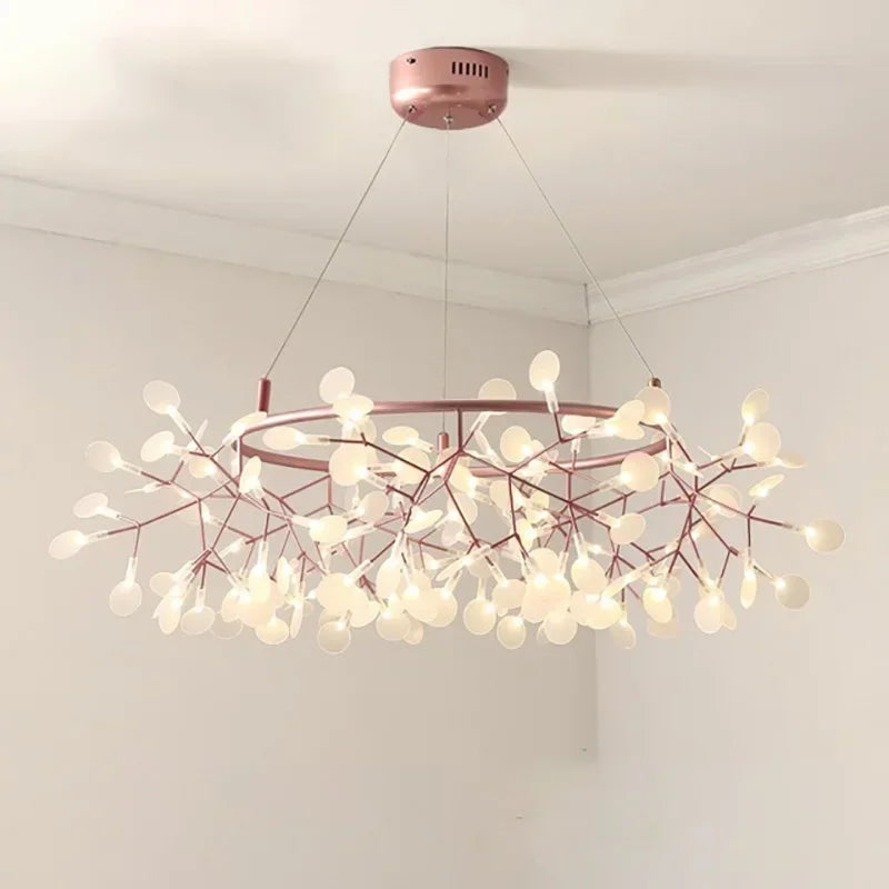 Chandelier with pink branches and white lights on a white ceiling
