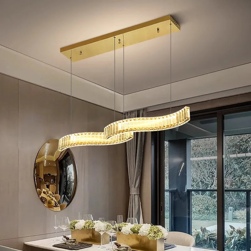 Modern alloy LED pendant chandelier lighting up an elegant dining room