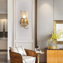 “Elegant gold leaves wall sconce for stylish home interiors”