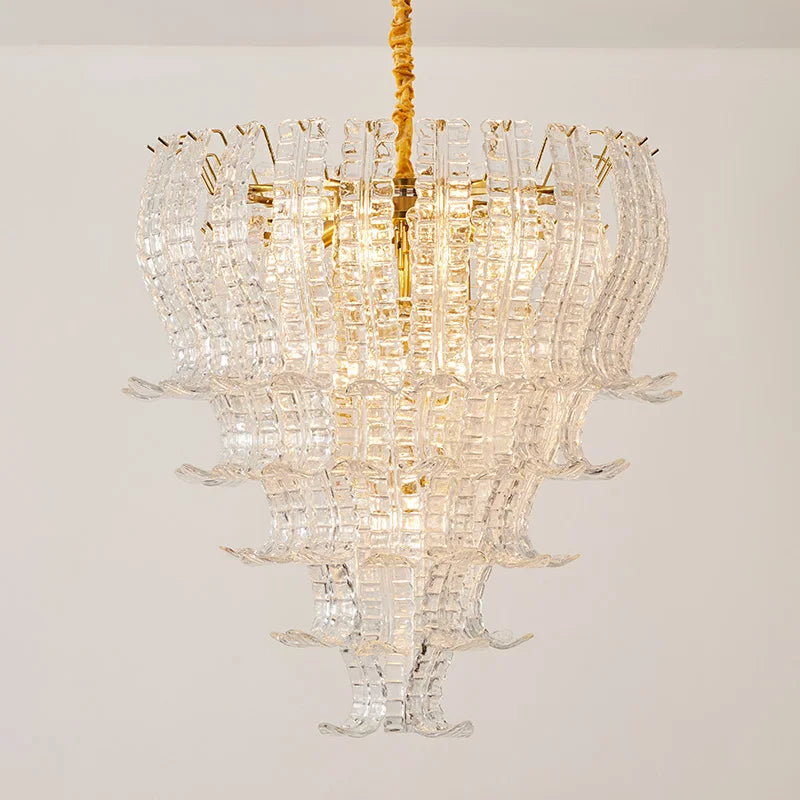 Crystal chandelier with gold accents on a plain background