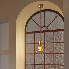“Brass accent amber glass LED pendant for bedroom, restaurant, or living room”