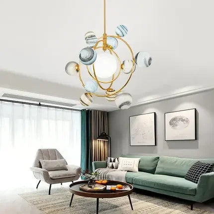 Polished chrome planetary pendant lamp lighting up a modern bedroom