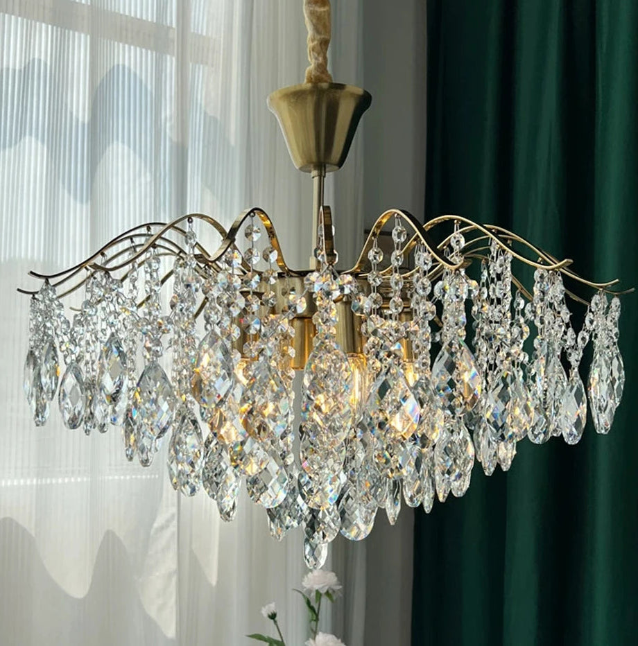Plated polished steel crystal chandelier adding sparkle to cottage interiors