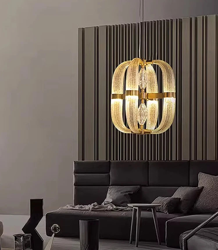 Polished steel chandelier with unique glass shapes illuminating a luxury corridor

