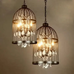 Two vintage-style chandeliers with crystal accents on a neutral background . Retro birdcage crystal chandelier for restaurant and living room.