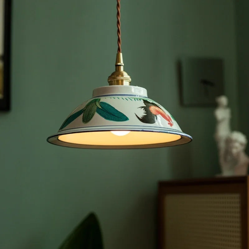 Pendant light with floral design on a green wall ; Retro hand-painted ceramic and brass E27 pendant lamp.