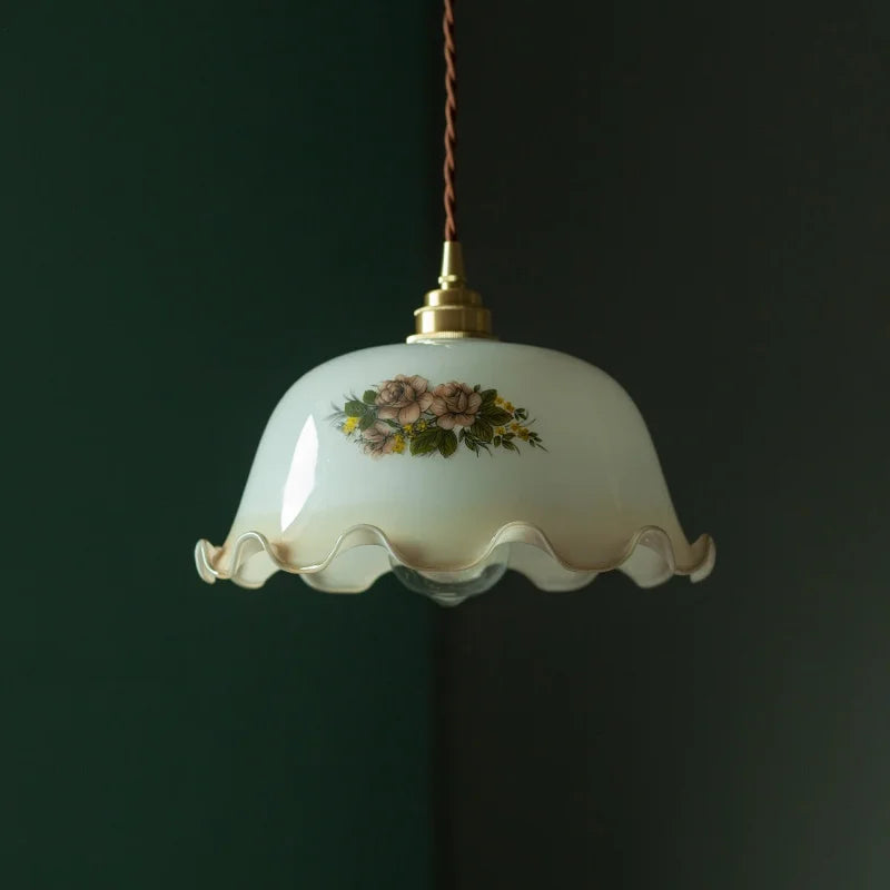 Decorative pendant light with floral design on a dark background.  Retro floral hanging light for restaurants or bedrooms.