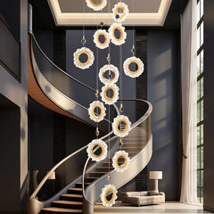 “Sculptural modern chandelier with cascading alloy rings”