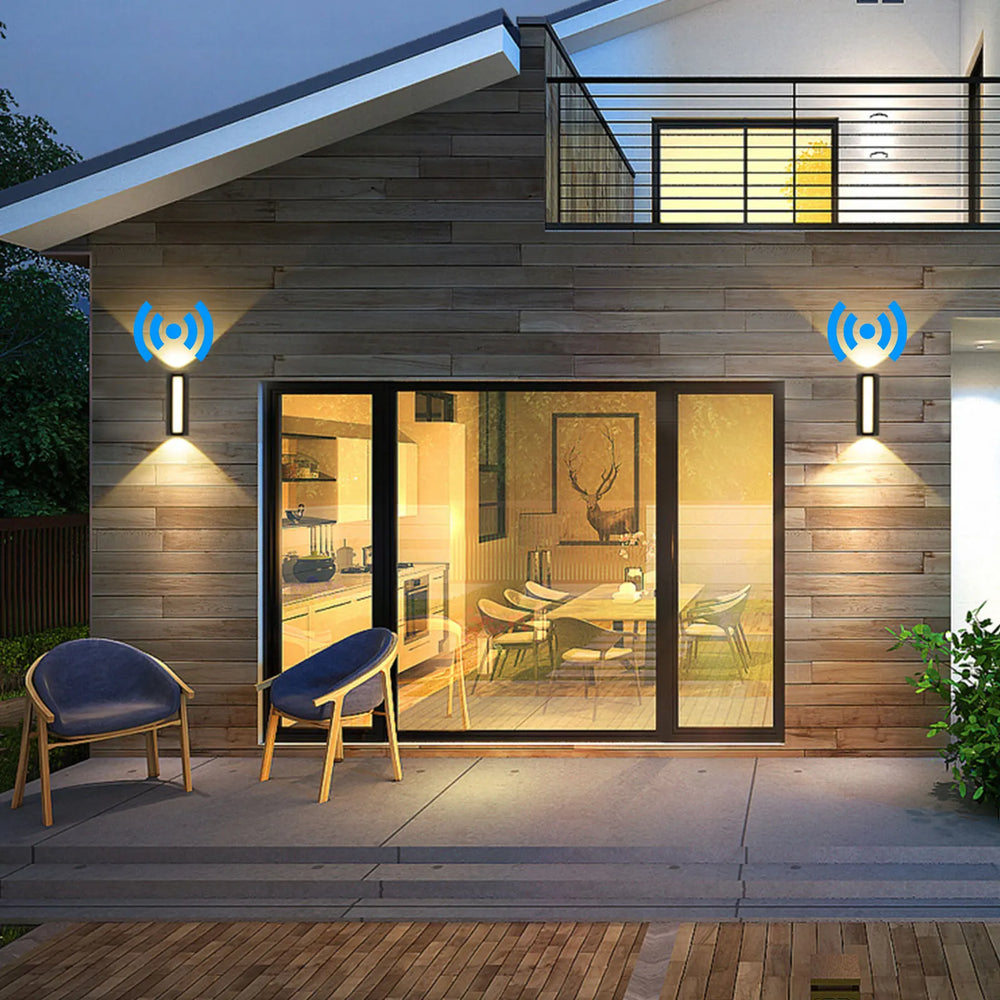 “Minimalist up-down LED wall fixture mounted on a modern home facade.”