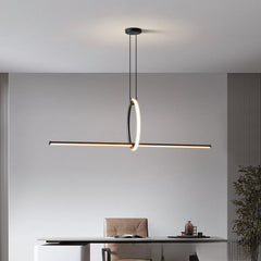 Modern pendant light hanging above a desk in an office setting.