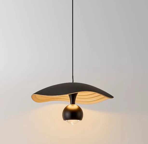 Sleek pendant chandelier lighting up a cozy study or home bar