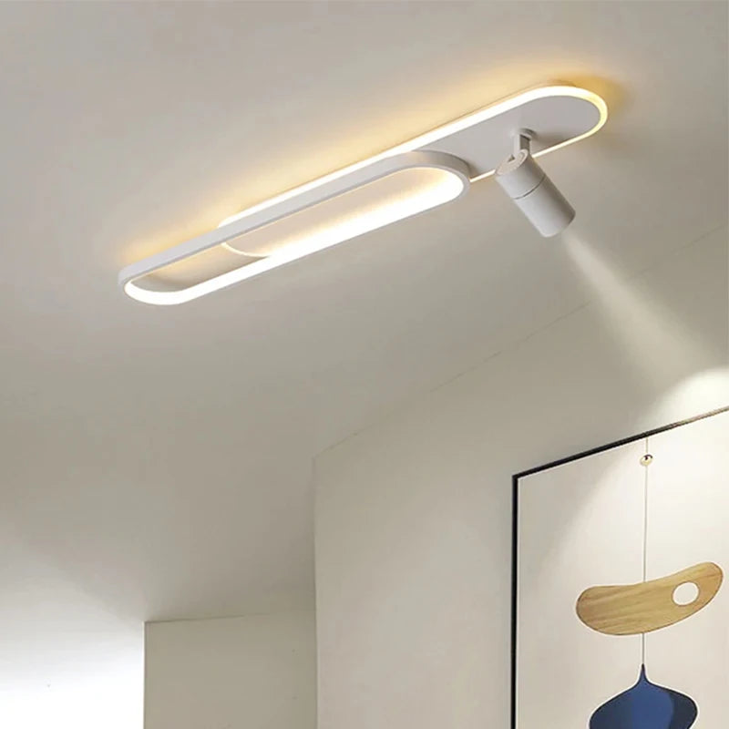 Linear ceiling light fixture with directional spotlights for accent lighting