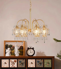 Traditional style crystal-accent chandelier installed in living room as ceiling feature