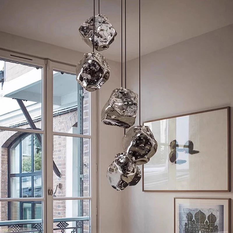 Warm white glow from triple-color LED lava glass chandelier in dining room setting