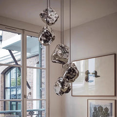 Warm white glow from triple-color LED lava glass chandelier in dining room setting