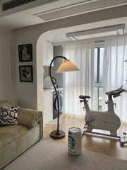 “Mid-century reading lamp with cloth shade and wood stand”