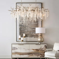 “Vintage copper crystal branch chandelier over dining table”