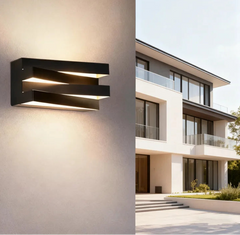 “Black LED wall lamp casting horizontal light along a landscaped garden path.”