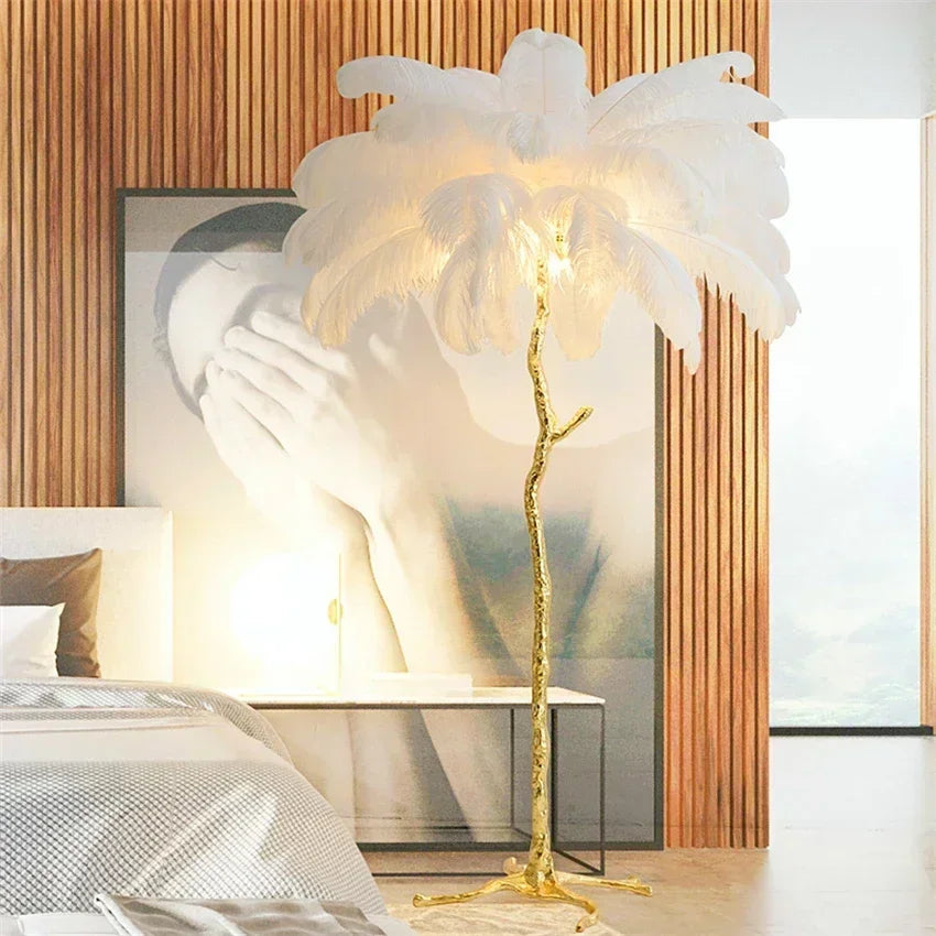 Decorative floor lamp with white feathered shade in a modern room setting.
